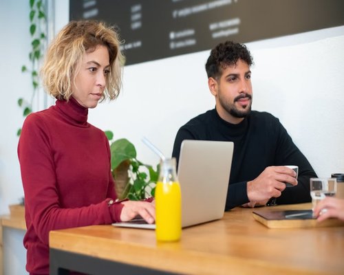 Editorial team working together at a cafe
