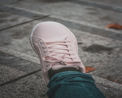 Person wearing comfortable sneakers standing on stairs