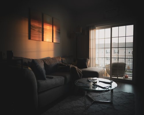 A quiet room at dusk implying rest